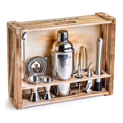 stainless steel cocktail shaker set in wood stand